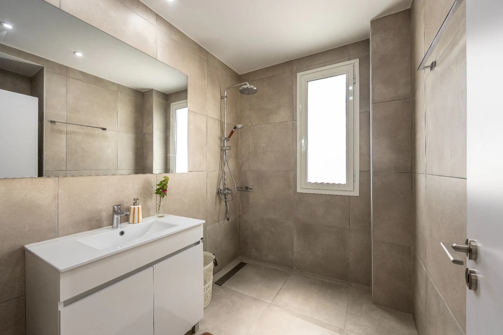 A bathroom with a walk-in shower.