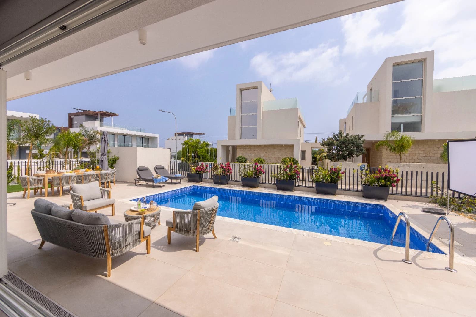The covered terrace lounge alongside the pool.